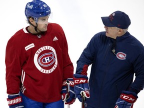 Canadiens head coach Dominique Ducharme speaks with defenceman Chris Wideman during training-camp practice at the Bell Sports Complex in Brossard.