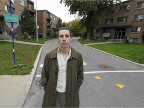 Duncan McLachlan, standing outside some apartment buildings in Pointe-Claire, is the TQSOI project coordinator for a West Island tenants' rights association.