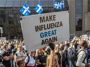 Montrealers protested against vaccine mandates in Montreal on Saturday, Oct. 9, 2021, as a court challenge is going to be filed to temporarily halt the province's suspension without pay of all non-vaccinated health-care workers.