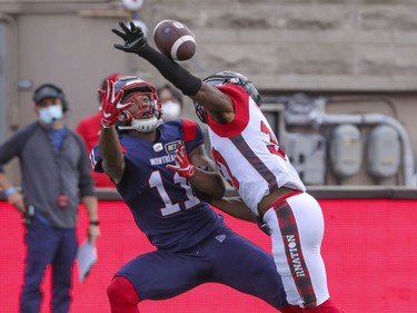 Ottawa Redblacks Brandin Dandridge deflects a pass intended for Montreal Alouettes Kaion Julien-Grant during  first half of Canadian Football League game in Montreal Monday October 11, 2021.