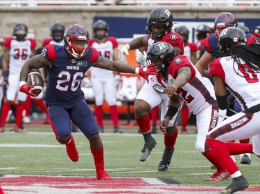 Montreal Alouettes running back Cameron Artis-Payne runs with the football against the Ottawa Redblacks defence during Canadian Football League game in Montreal Monday October 11, 2021.