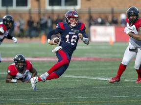 Alouettes quarterback Matthew Shiltz runs for a first down during game-winning drive against the Ottawa Redblacks in Canadian Football League game in Montreal Monday Oct. 11, 2021.