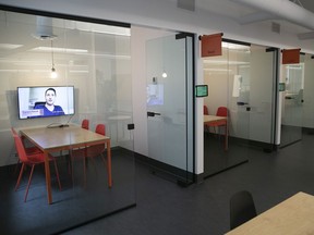 Multiple soundproof glass booths at video-game maker Ludia’s expanded space allow for quiet face-to-face meetings or video chats.