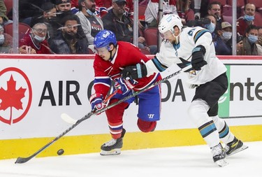 Montreal Canadiens' Brendan Gallagher controls the puck while being pursued by San Jose Sharks' Erik Karlsson during third period at the Bell Centre Tuesday, Oct.r 19, 2021.