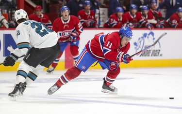 Montreal Canadiens' Brendan Gallagher sidesteps a check by San Jose Sharks' Jasper Weatherby during third period at the Bell Centre Tuesday, Oct. 19, 2021.