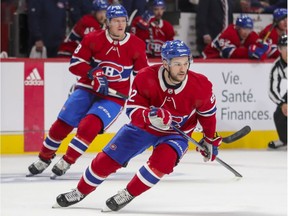 Montreal Canadiens' Jonathan Drouin and Christian Dvorak, rear, change directions during first period against the San Jose Sharks in Montreal on Oct. 19, 2021.