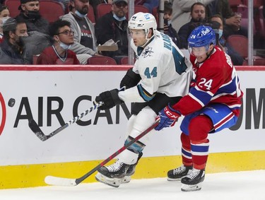 Montreal Canadiens' Adam Brooks forechecks San Jose Sharks' Marc-Edouard Vlasic during first period at the Bell Centre on Tuesday, Oct. 19, 2021.