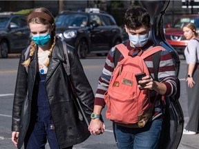 Montrealers continue to wear masks in the city streets on Wednesday October 20, 2021.