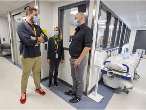 Unit manager Jennifer Moutinho meets with medical manager Dr. Oliver Gil, left, and Dr. Fred Van Den Eynde, chief of psychiatry, in the short-stay inpatient mental health unit at the Lakeshore General Hospital in Pointe-Claire, on Monday.