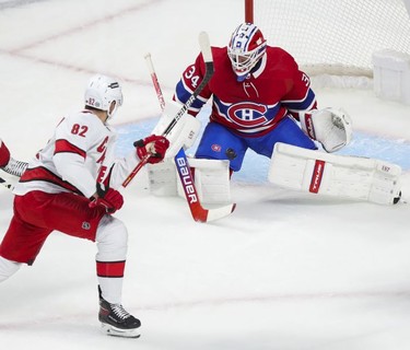 Carolina Hurricanes' Jesperi Kotkaniemi has his shot stopped by Montreal Canadiens goalie Jake Allen during first period at the Bell Centre Thursday, Oct. 21, 2021.