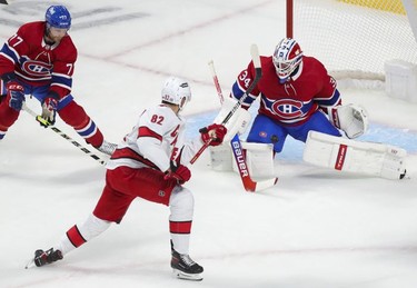 Carolina Hurricanes Jesperi Kotkaniemi has his shot stopped by Montreal Canadiens goalie Jake Allen during first period at the Bell Centre Thursday, Oct. 21, 2021.