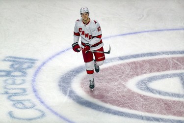 Former Montreal Canadien Jesperi Kotkaniemi skates across centre ice during warmup with his Carolina Hurricanes prior to game at the Bell Centre on Thursday, Oct. 21, 2021.