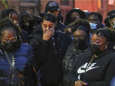 Family and friends listen to prayers at a vigil for Jannai Dopwell-Bailey in Montreal on Friday, Oct. 22, 2021.