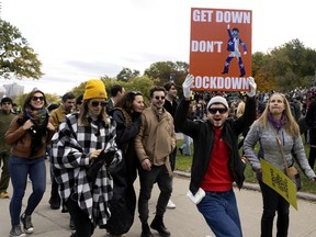 Montrealers take part in a dance party to urge Quebec to open dance floors during a protest on Saturday, Oct. 23,  2021, on Mount Royal.