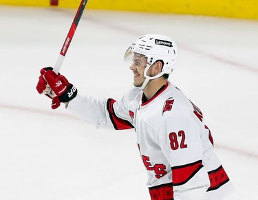 Carolina Hurricanes' Jesperi Kotkaniemi celebrates his third-period goal against the Montreal Canadiens at the Bell Centre on Thursday, Oct. 21, 2021.