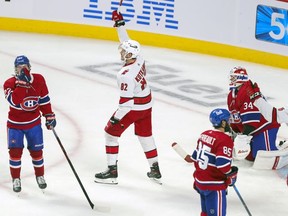 Carolina Hurricanes' Jesperi Kotkaniemi celebrates his third-period goal against the Montreal Canadiens at the Bell Centre on Thursday, Oct. 21, 2021.