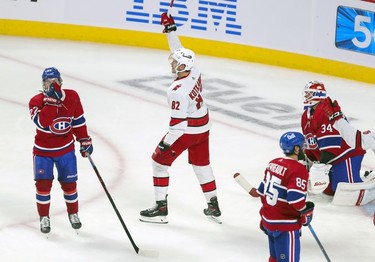 Carolina Hurricanes' Jesperi Kotkaniemi celebrates his third-period goal against the Montreal Canadiens at the Bell Centre on Thursday, Oct. 21, 2021.