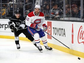 Canadiens' Jonathan Drouin skates the puck against Lias Andersson of the Los Angeles Kings in the first period at Staples Center on Saturday, Oct. 30, 2021, in Los Angeles.