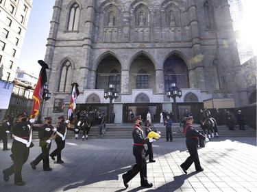 The Montreal Fire Department honour guard arrives at Notre-Dame Basilica for the funeral service for fallen firefighter Pierre Lacroix in Montreal on Friday, Oct. 29, 2021.