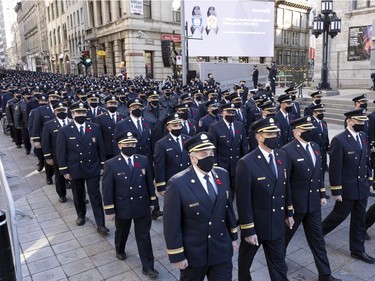Firefighters and police arrive at Notre-Dame Basilica for the funeral service for fallen firefighter Pierre Lacroix in Montreal on Friday, Oct. 29, 2021.