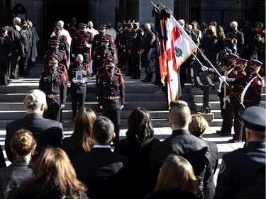 The honour guard carries the urn of fallen firefighter Pierre Lacroix during his funeral at Notre-Dame Basilica in Montreal on Friday, Oct. 29, 2021.