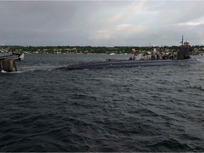 In this image released by the U.S. Navy, the Seawolf-class fast-attack submarine USS Connecticut (SSN 22) departs Naval Base Kitsap-Bremerton for deployment in Bremerton, Washington on May 27, 2021.