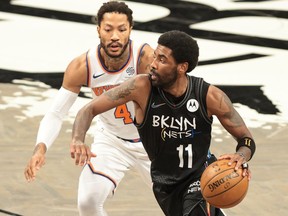 Apr 5, 2021; Brooklyn, New York, USA; Brooklyn Nets guard Kyrie Irving (11) dribbles the ball against New York Knicks guard Derrick Rose (4)during the second quarter at Barclays Center.