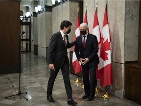 Prime Minister Justin Trudeau with then Foreign Affairs Minister Marc Garneau on Parliament Hill on Sept. 24, 2021, after announcing that Canadians Michael Spavor and Michael Kovrig had been released from detention in China.