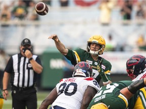 Edmonton Elks quarterback Trevor Harris throws against the Montreal Alouettes during first half  in Edmonton on Aug. 14, 2021.