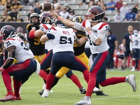 Alouettes quarterback Matthew Shiltz (18), in to replace Montreal quarterback Vernon Adams Jr., throws during first half CFL football game action against the Tiger Cats in Hamilton on Saturday, Oct. 2, 2021.