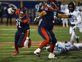Alouettes running-back William Stanback avoids a tackle against the Argonauts during second-quarter action at Molson Stadium Friday night.