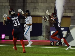Montreal Alouettes wide receiver Eugene Lewis (87) scores a touchdown against the Toronto Argonauts in the second quarter during a Canadian Football League game at Molson Stadium.