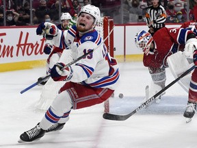 New York Rangers forward Alexis Lafreniere (13) celebrates after scoring a goal against Canadiens goalie Jake Allen during the third period at the Bell Centre in Montreal on Saturday, Oct. 16, 2021.