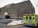 An ambulance pulls up to the emergency department of the Lachine Hospital.