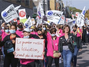 Daycare workers demonstrate on the first day of rotating strikes in Montreal on Tuesday, Oct. 12, 2021.