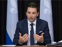 Quebec Justice Minister Simon Jolin-Barrette, left, explains legislation that would create a special tribunal treating sexual crimes, Wednesday, September 15, 2021 at the legislature in Quebec City.