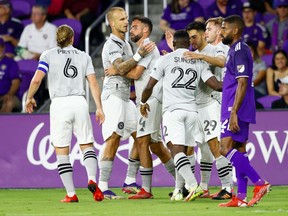 CF Montréal defender Rudy Camacho, 4, is congratulated after scoring the tying goal in the second half against Orlando City in a 1-1 draw.