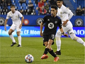 CF Montreal midfielder Joaquin Torres (18) plays the ball against Atlanta United FC during the first half at Stade Saputo on Oct. 2, 2021.