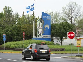 A car from New Jersey crosses into Quebec at the border crossing, Monday, August 9, 2021  in Lacolle, Que., south of Montreal. A Canadian who has been living in the United States asked Paul Delean about some of the tax implications for  pensioners who move back to Quebec.