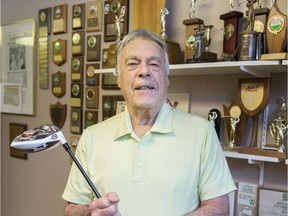 Wes Young, pictured here with his golf trophies in 2019, died on Nov. 5, 2021.