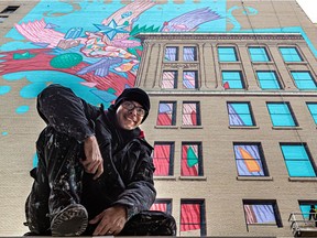 Rafael Sottolichio, foreground, and assistants Arnaud Gregoire and Julian Palma are painting a mural commissioned by Tourisme Montréal.