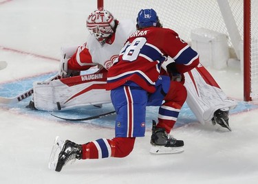 Detroit Red Wings goaltender Alex Nedeljkovic stops shot from Montreal Canadiens' Christian Dvorak during second-period action in Montreal on Tuesday, Nov. 2, 2021.
