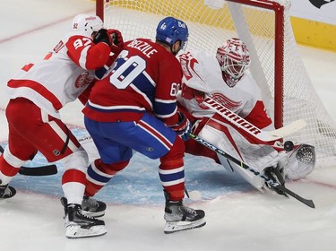 Montreal Canadiens' Alex Belzile shoots on Detroit Red Wings goaltender Alex Nedeljkovic, while being closely checked by centre Vladislav Namestnikov (92) during second period NHL action in Montreal on Tuesday November 02, 2021. (Pierre Obendrauf / MONTREAL GAZETTE) ORG XMIT: 66937 - 5699