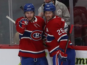 Montreal Canadiens' Josh Anderson (17) celebrates his goal with teammate Jeff Petry (26) during first-period action in Montreal on Tuesday, Nov. 2, 2021.