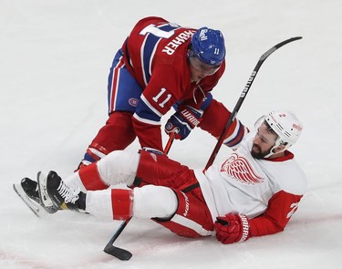 Montreal Canadiens' Brendan Gallagher brings down Detroit Red Wings' Nick Leddy during second-period action in Montreal on Tuesday, Nov. 2, 2021.