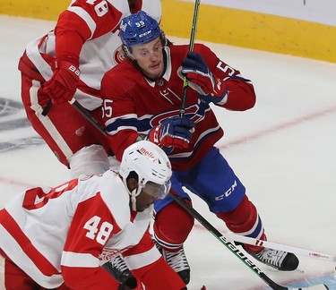 Montreal Canadiens' Michael Pezzetta shows his determination as he gets in on the play with Detroit Red Wings' Givani Smith during second-period action in Montreal on Tuesday, Nov. 2, 2021.