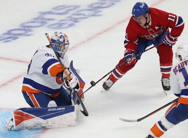 Montreal Canadiens' Brendan Gallagher (11) shoots puck on New York Islanders goaltender Ilya Sorokin during third-period action in Montreal on Thursday, Nov. 4, 2021.