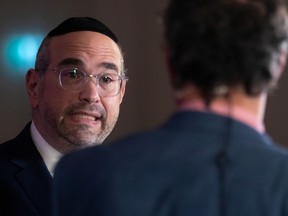 Lionel Perez is interviewed on election night at the Ensemble Montréal election headquarters at the EVO Hotel in Montreal on Sunday, Nov. 7, 2021.  Perez defeated incumbent mayor Sue Montgomery in Côte-des-Neiges–Notre-Dame-de-Grâce.