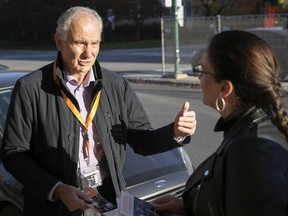 Peter Malouf talks with local resident Lori Ann Emanovich on Graham Blvd. while doing door-to-door campaigning for mayor of T.M.R. on Thursday November 4, 2021.