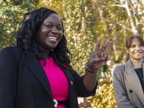 Gracia Kasoki Katahwa, the borough mayor-elect in Côte-des-Neiges-Notre-Dame-de-Grâce flashes a V for victory at a press conference on Nov. 8, 2021.